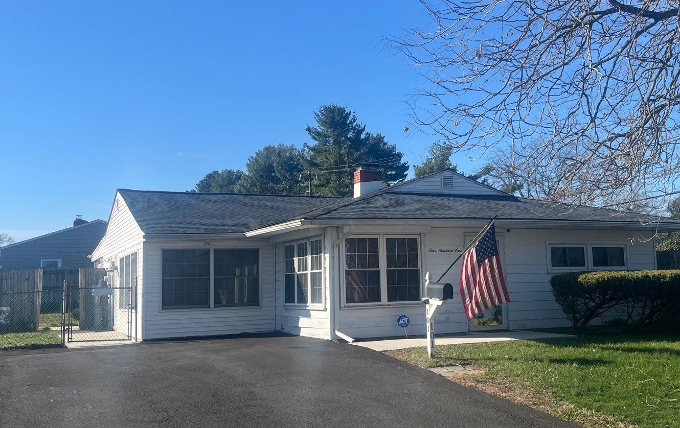 Before image from the street of a home in Newark before full siding replacement