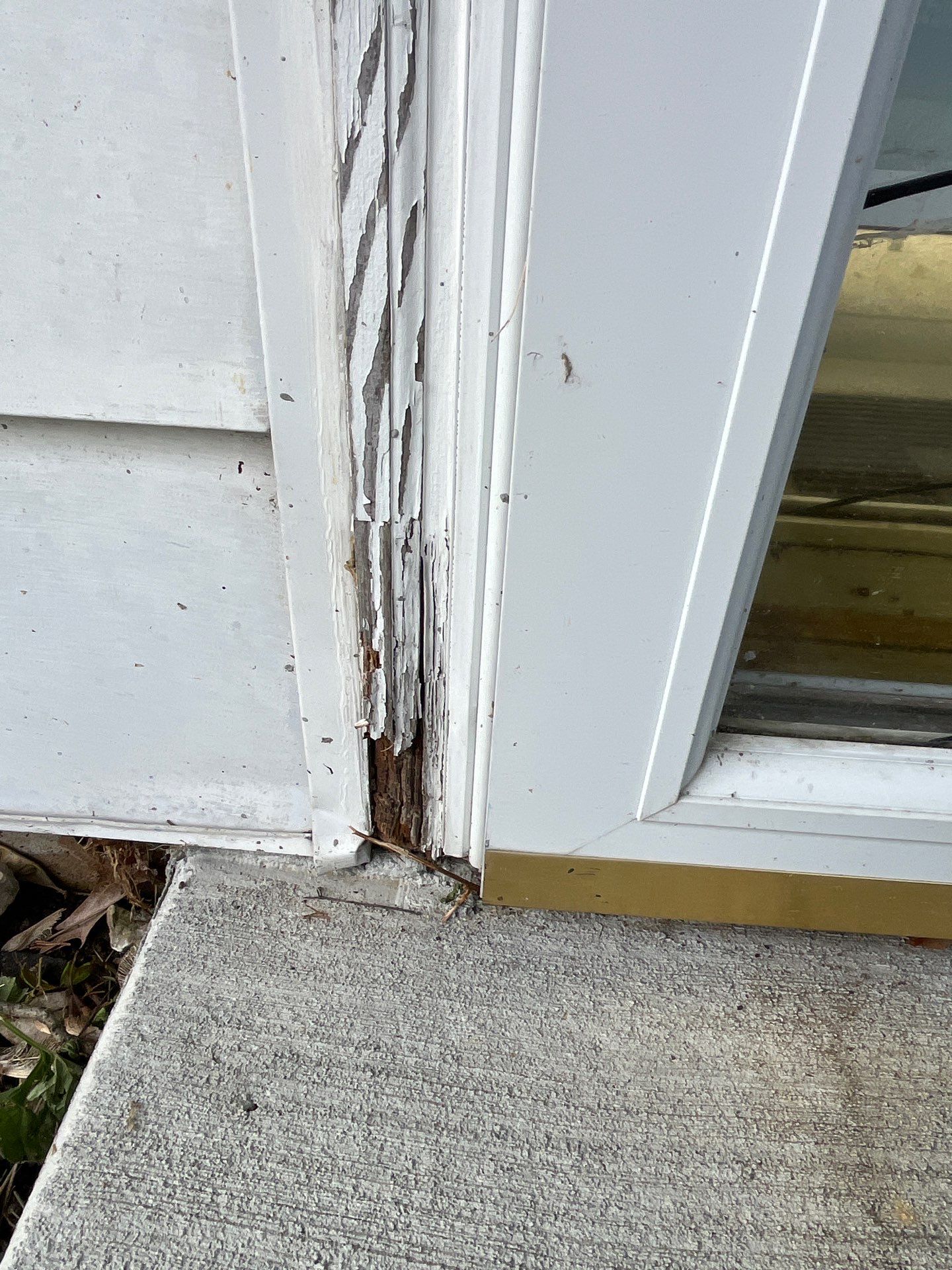 Closeup of damaged wood trim on a Newark home