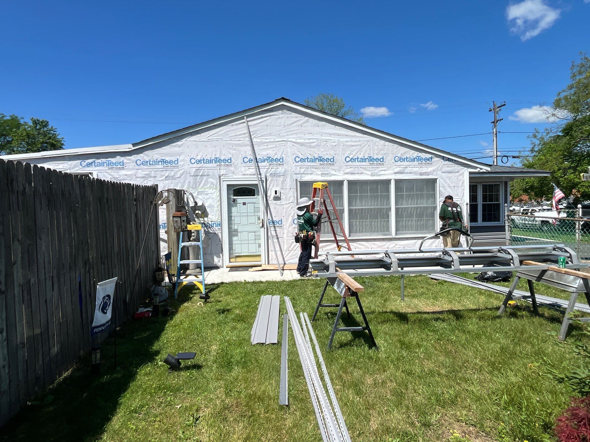Project in progress installing certainteed weather resistant barrier