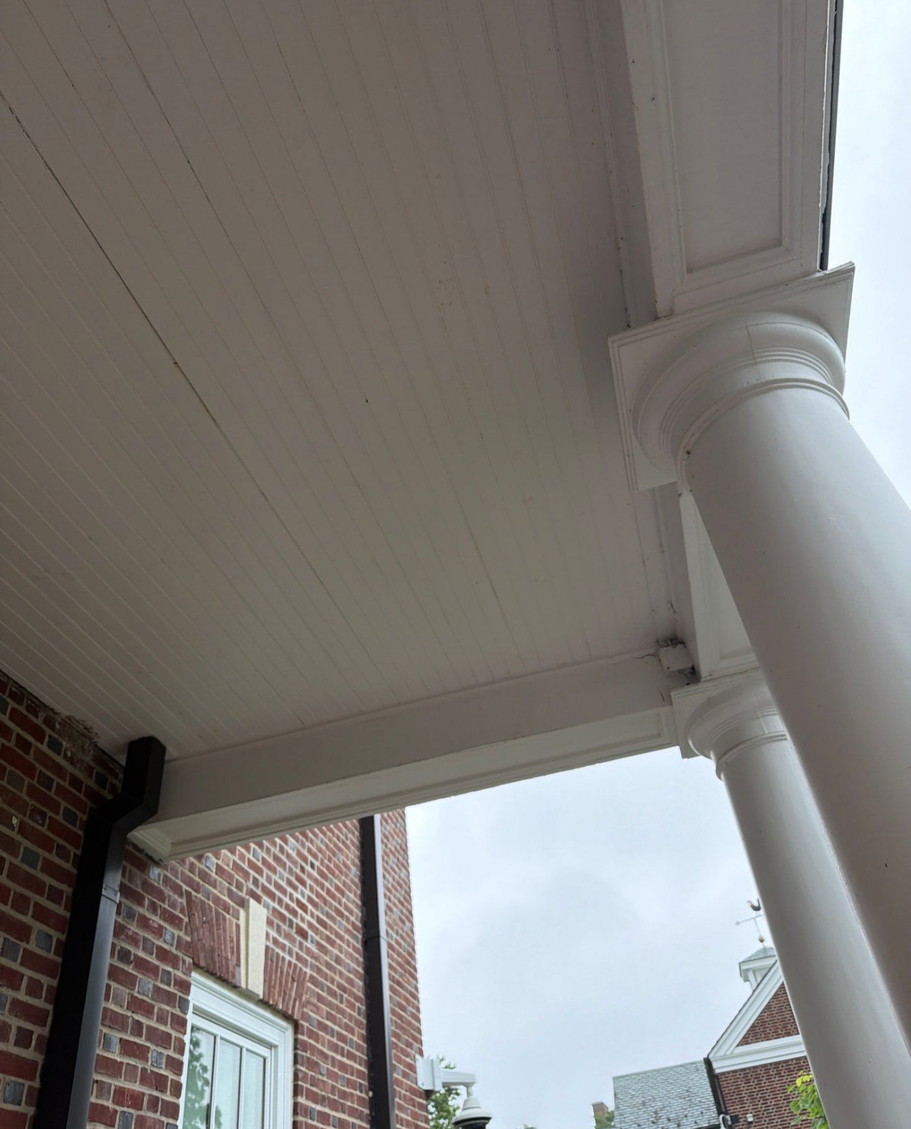 Balcony ceiling, soffit on Warner Hall freshly painted by Paddy's
